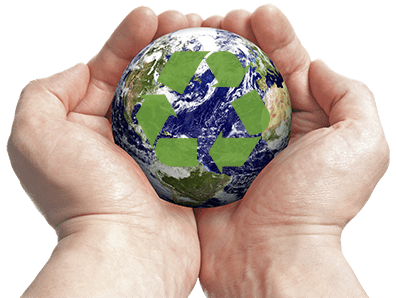 Hands holding a miniature earth with a recycle symbol on it.